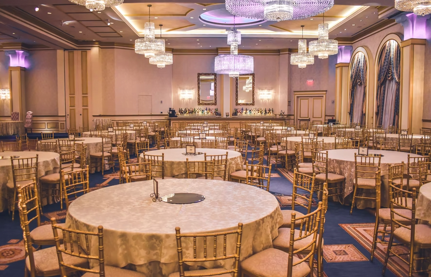 a number of tables and chairs for an event