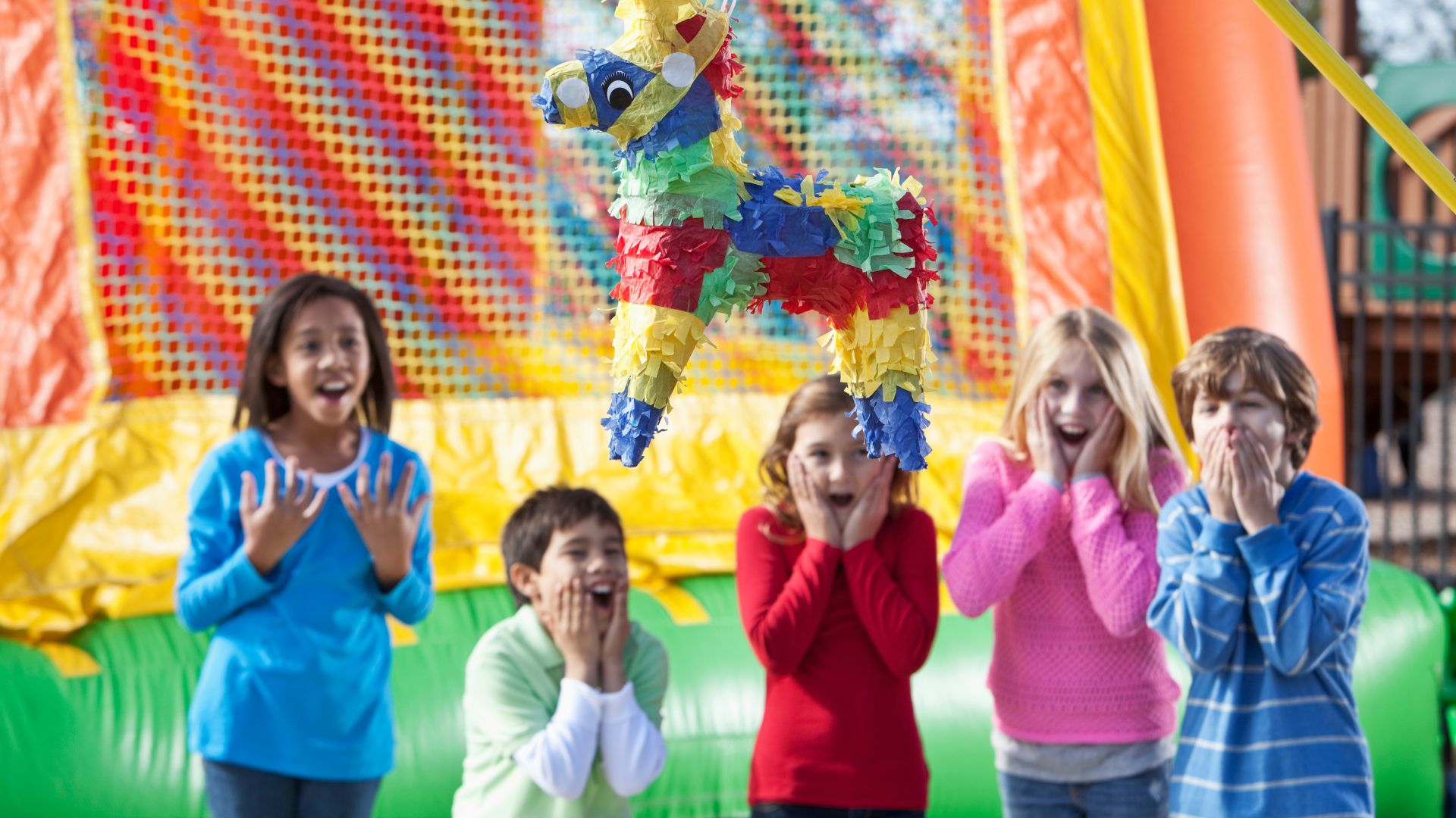 Kids playing with a pinata