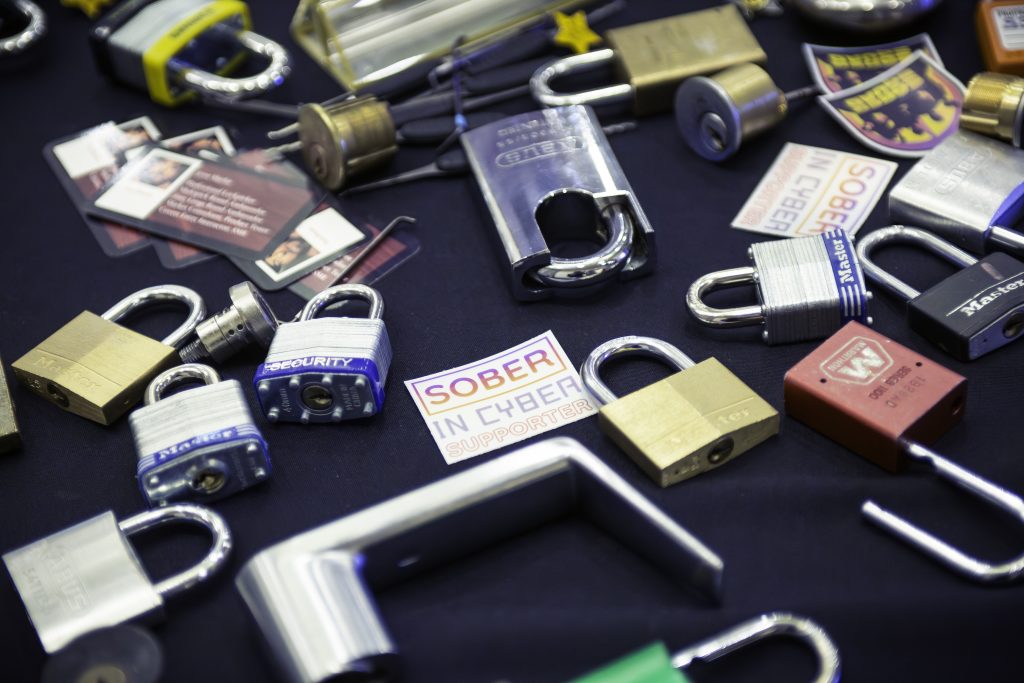 Interactive activity table with lockpicking tools at a corporate event