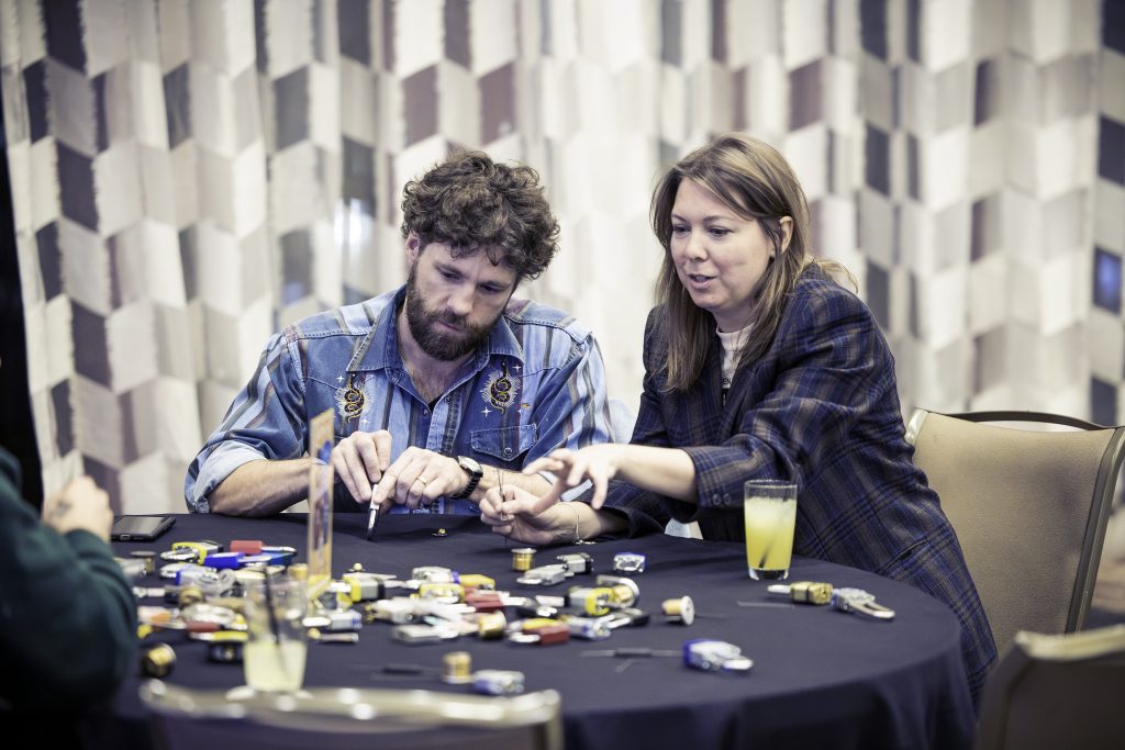 Attendees participating in an interactive team activity at a corporate event