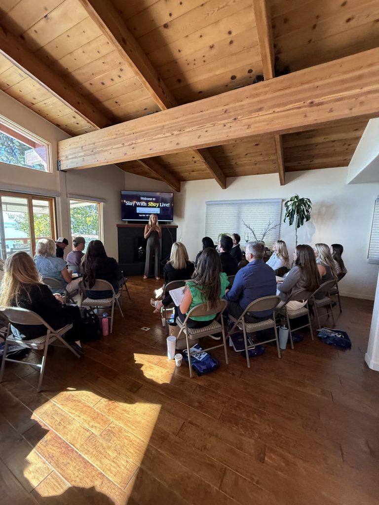 Attendees seated and listening to a speaker during a corporate event workshop